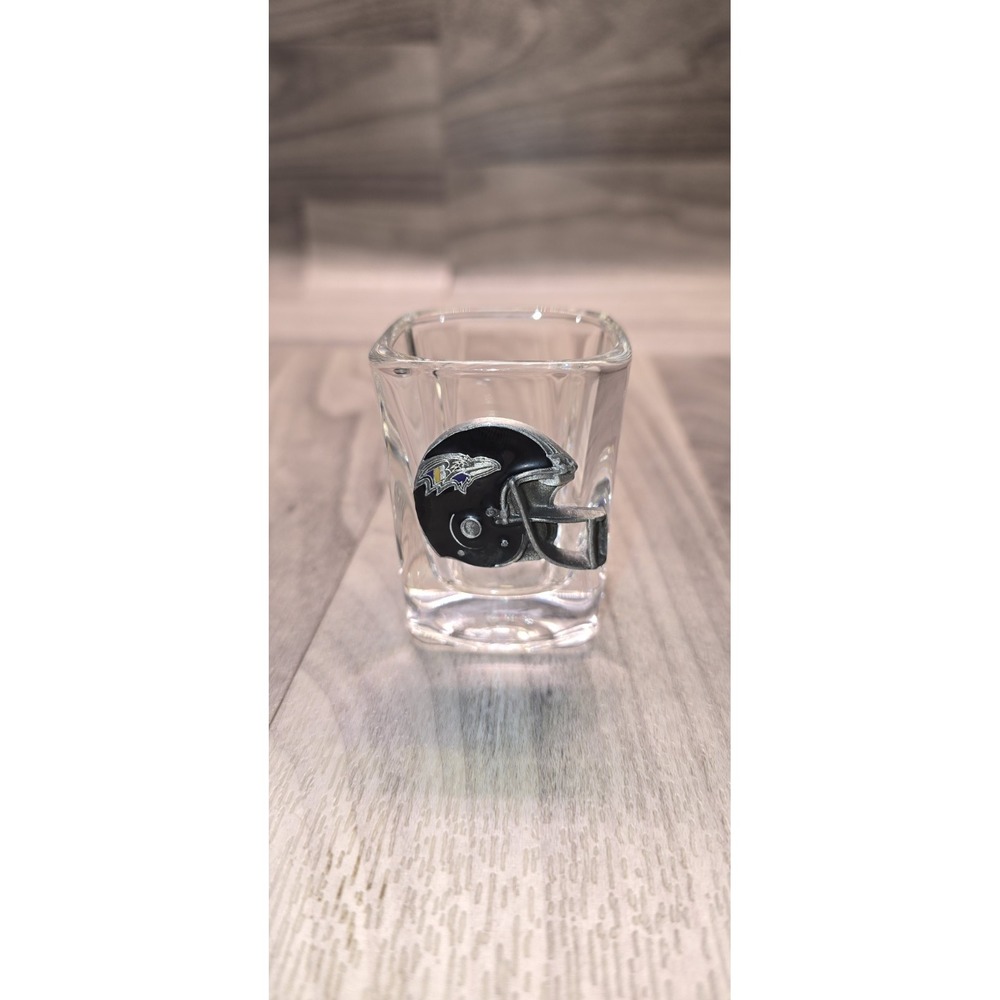 collector shot glass W/ an attached miniature Baltimore Ravens football helmet